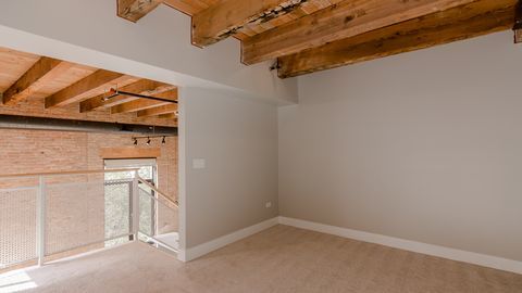 729 North Sangamon Street, Unit 401 Chicago, IL 60642 - Photo 28 of 38 a view of a room with racks on the wall