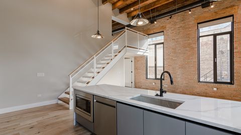 729 North Sangamon Street, Unit 401 Chicago, IL 60642 - Photo 5 of 38 a kitchen with a sink and cabinets