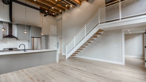 729 North Sangamon Street, Unit 401 Chicago, IL 60642 - Photo 7 of 38 a view of a kitchen with a sink and cabinets