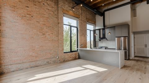 729 North Sangamon Street, Unit 401 Chicago, IL 60642 - Photo 9 of 38 a kitchen with stainless steel appliances a refrigerator and a stove