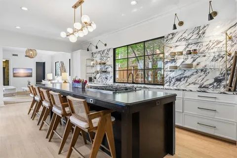 a kitchen with a table and chairs in it