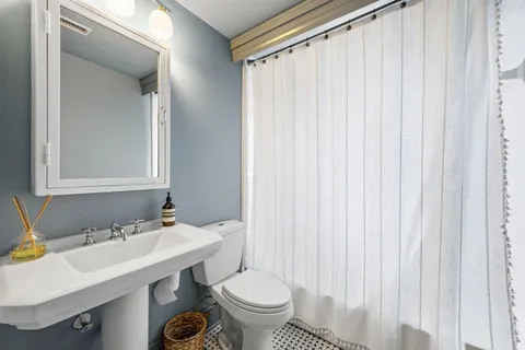 a bathroom with a sink and a toilet