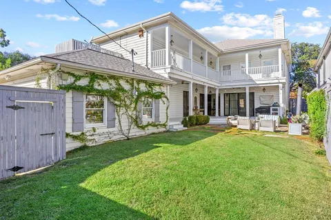a view of a house with a yard porch and sitting area