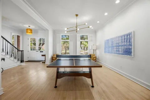 a view of a livingroom with furniture window and wooden floor