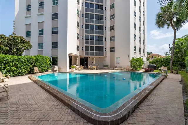 a view of swimming pool with outdoor seating