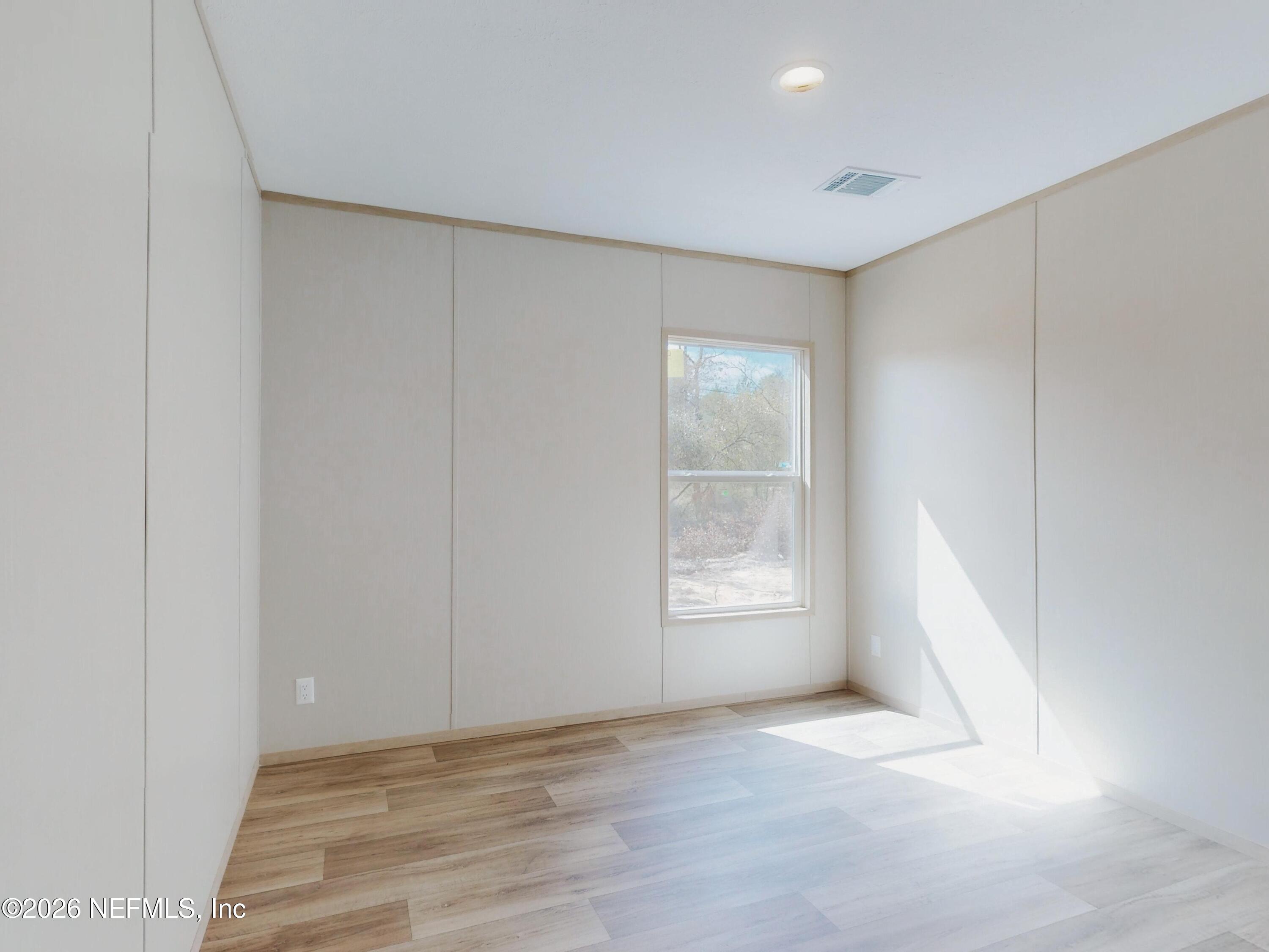 5770 Acadia Street Keystone Heights, FL 32656 - Photo 40 of 64 an empty room with windows