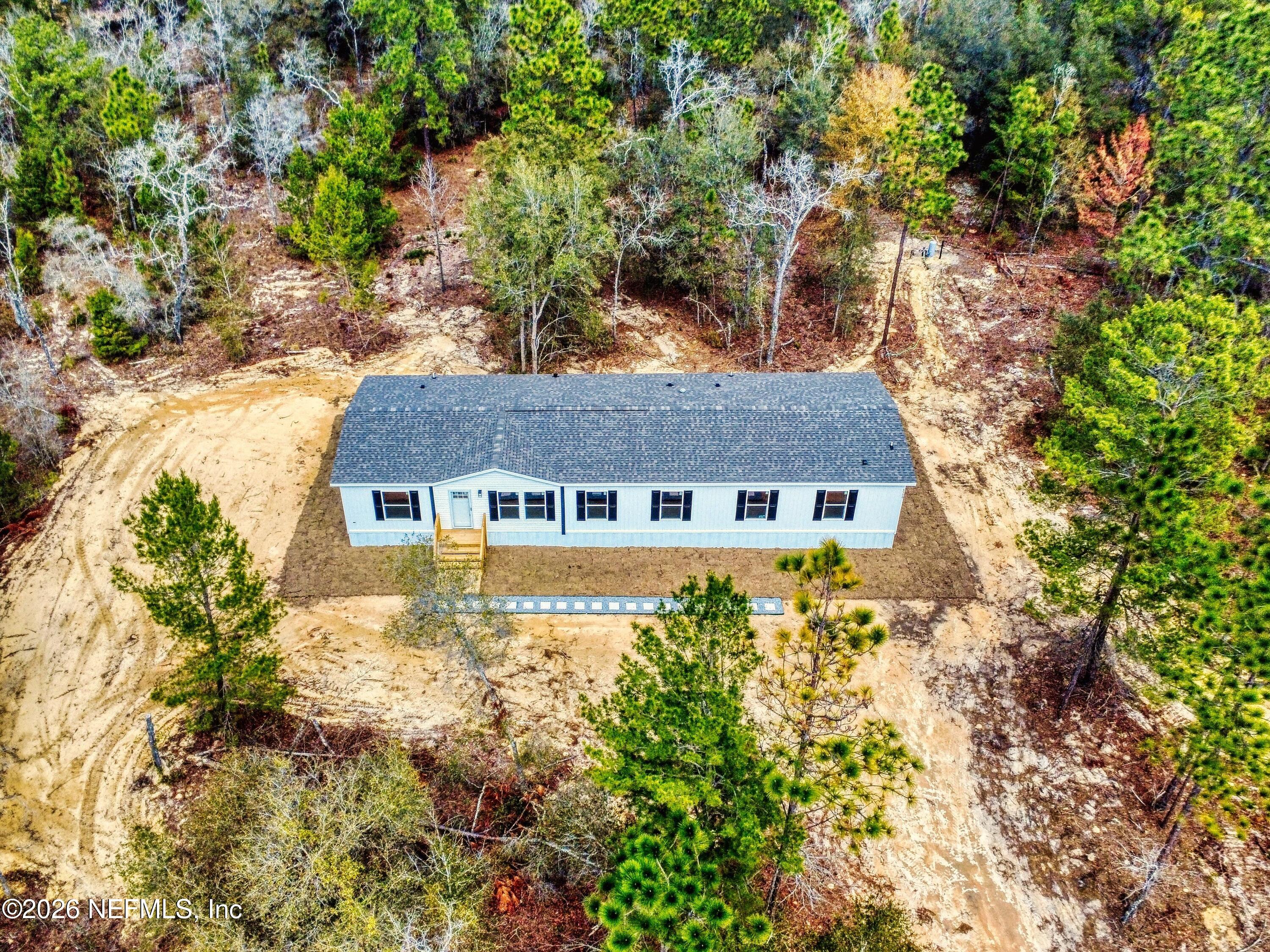 5770 Acadia Street Keystone Heights, FL 32656 - Photo 64 of 64 a view of a house with a yard