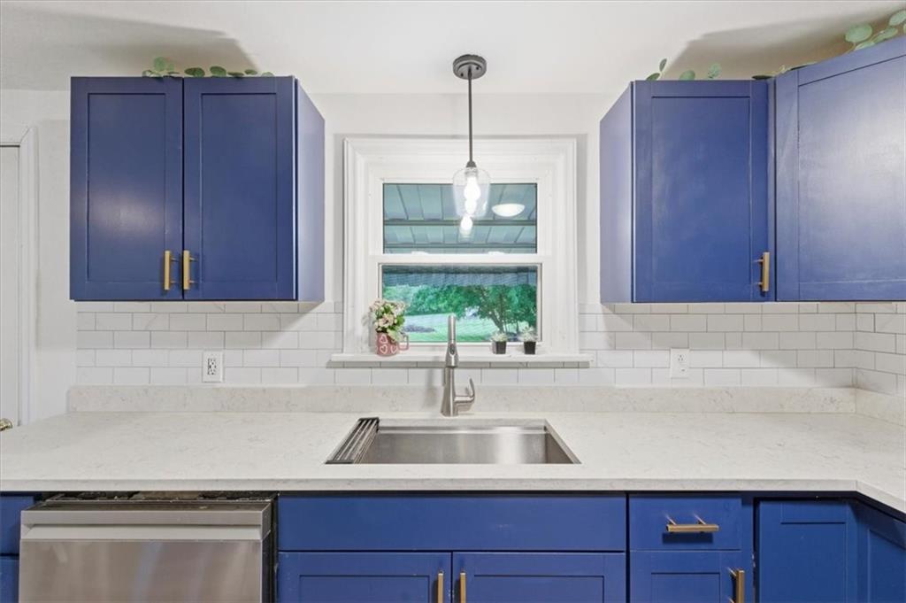 344 Winfield Road Cabot, PA 16023 - Photo 10 of 30 a kitchen with a sink and wooden cabinets