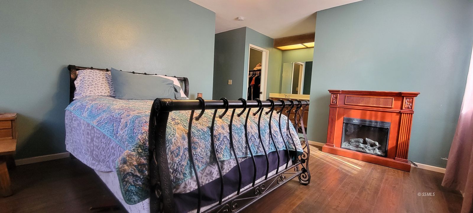 725 Ginger Avenue Ridgecrest, CA 93555 - Photo 15 of 29 a bed sitting in a bedroom next to a window