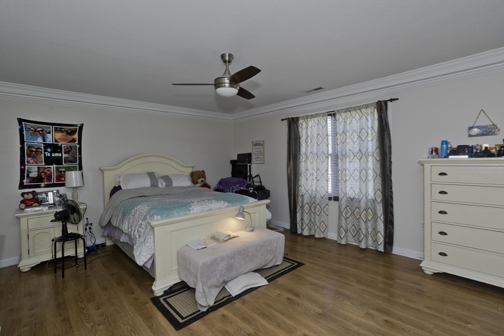 31 Acrebrook Road Springfield, MA 01129 - Photo 11 of 31 a bedroom with a bed and wooden floor