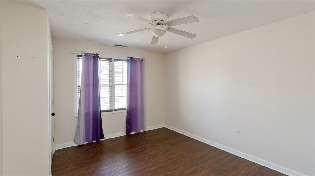 31 Acrebrook Road Springfield, MA 01129 - Photo 13 of 31 an empty room with wooden floor and windows