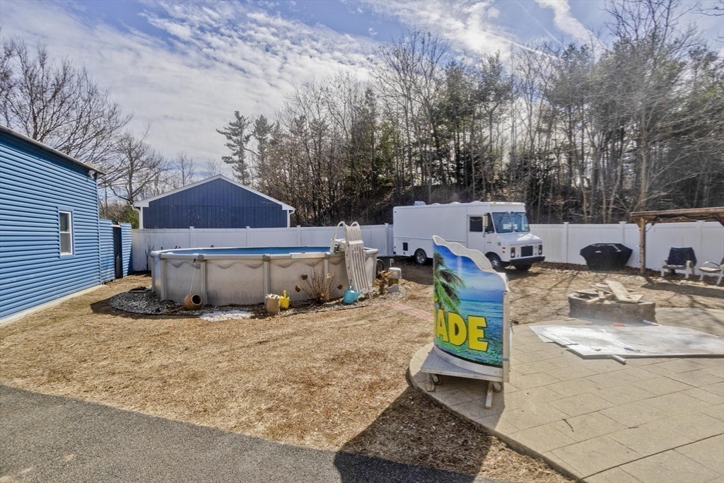 31 Acrebrook Road Springfield, MA 01129 - Photo 22 of 31 a view of a backyard with a car parked in it