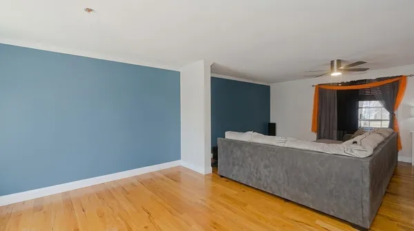 a living room with a couch and a fireplace