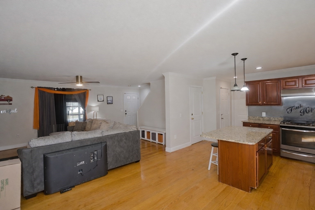 31 Acrebrook Road Springfield, MA 01129 - Photo 7 of 31 a kitchen with stainless steel appliances granite countertop a sink and stove top oven