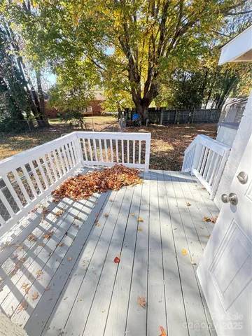 a view of deck with patio and wooden floor