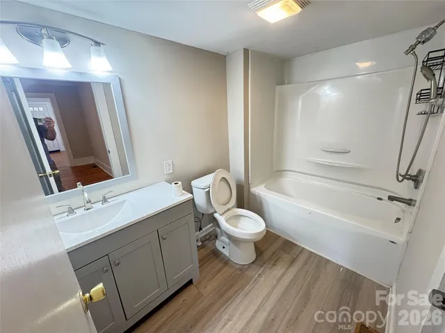 a bathroom with a sink toilet a tub and shower