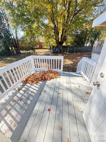 a view of deck with patio and wooden floor