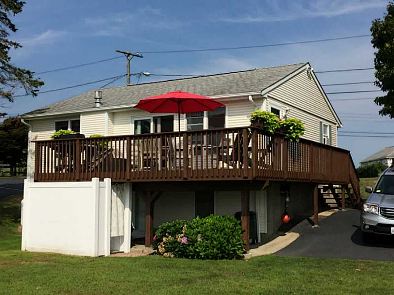 5 Barnacle Road Narragansett, RI 02882 - Photo 3 of 21 Exterior Back. Oversized deck and outdoor shower with hot & cold water to wash off the all the sand from a day at the beach!