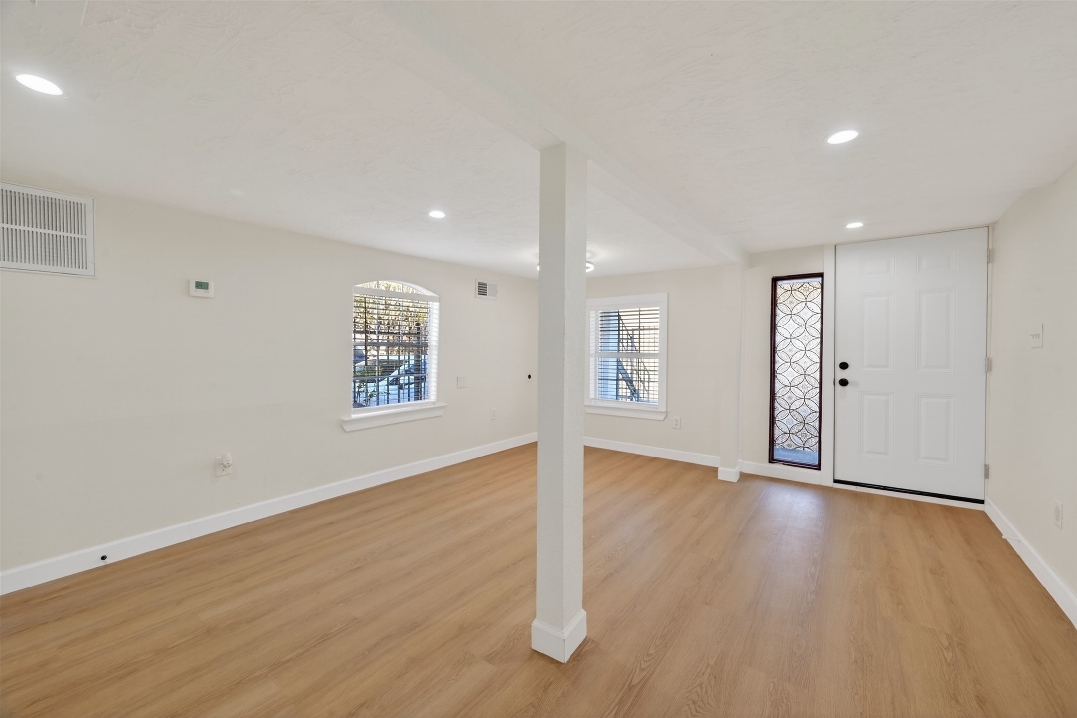 2118 Webster Street, Unit 3 Houston, TX 77003 - Photo 27 of 29 a view of an empty room with wooden floor