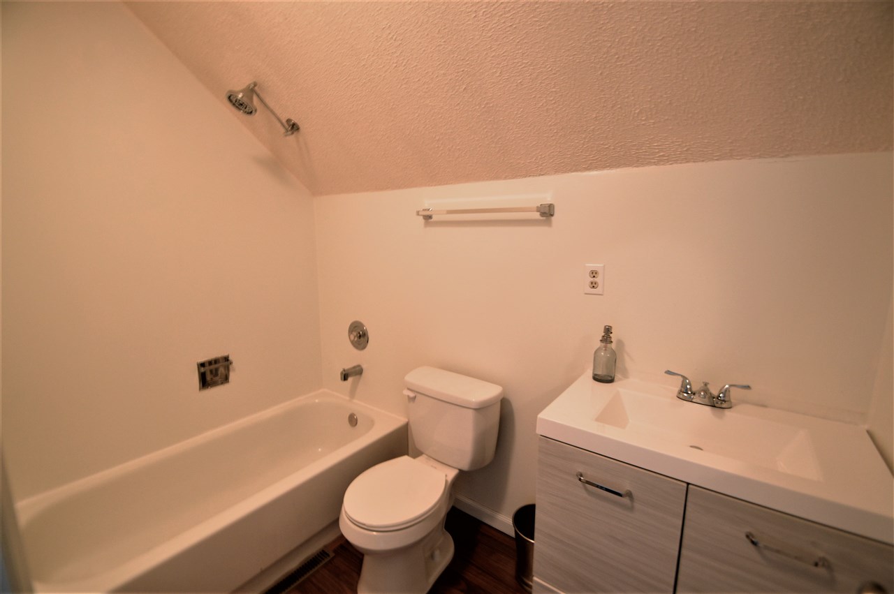 4830 Crown Point Circle Roscoe, IL 61073 - Photo 17 of 19 a bathroom with a sink a toilet and shower