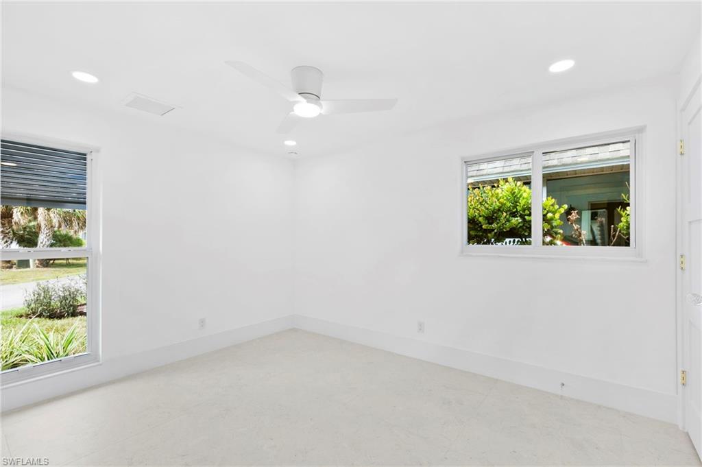 17 Knights Bridge Road Naples, FL 34112 - Photo 13 of 18 an empty room with windows