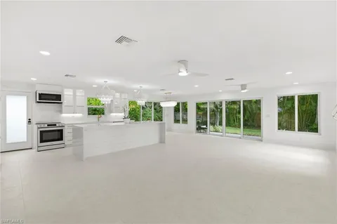 a view of kitchen with furniture and large window