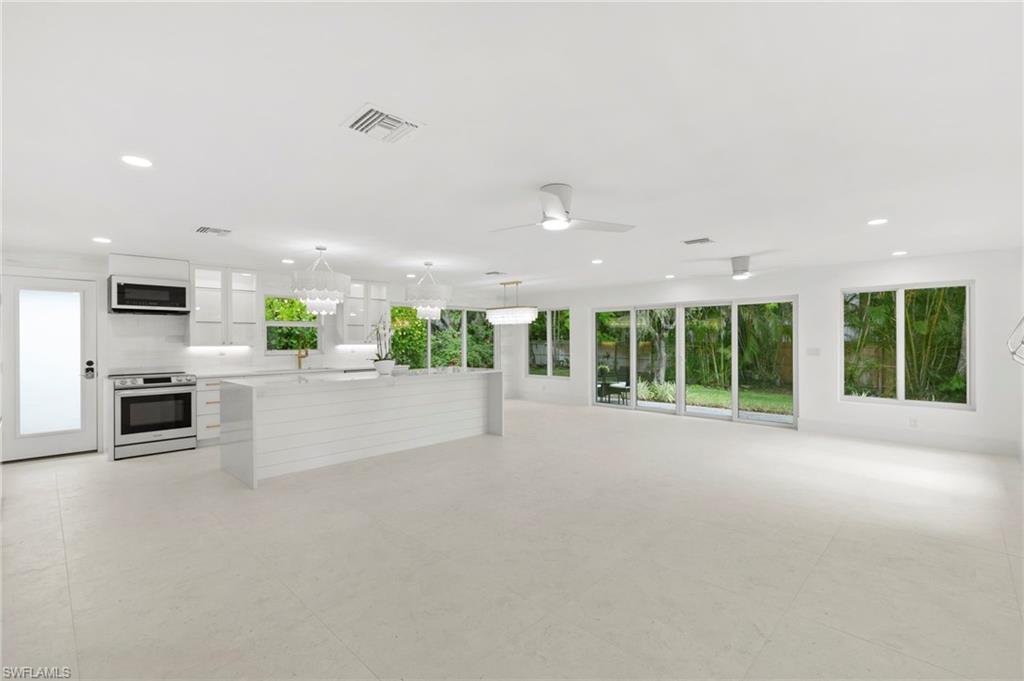 17 Knights Bridge Road Naples, FL 34112 - Photo 4 of 18 a view of kitchen with furniture and large window