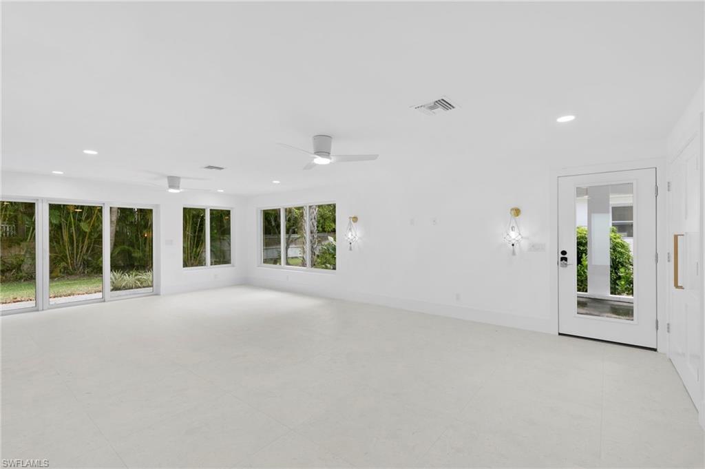 17 Knights Bridge Road Naples, FL 34112 - Photo 5 of 18 a view of an empty room with a window