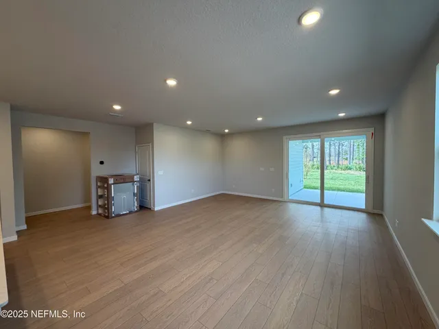 a view of kitchen with cabinets and wooden floor