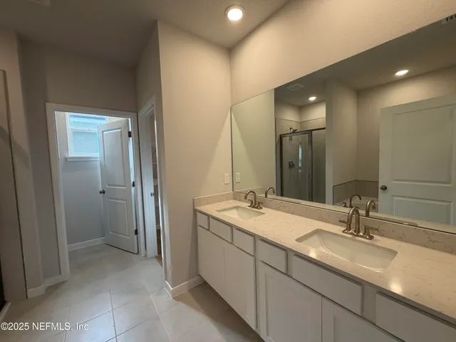 a view of an empty room and wooden floor and a window