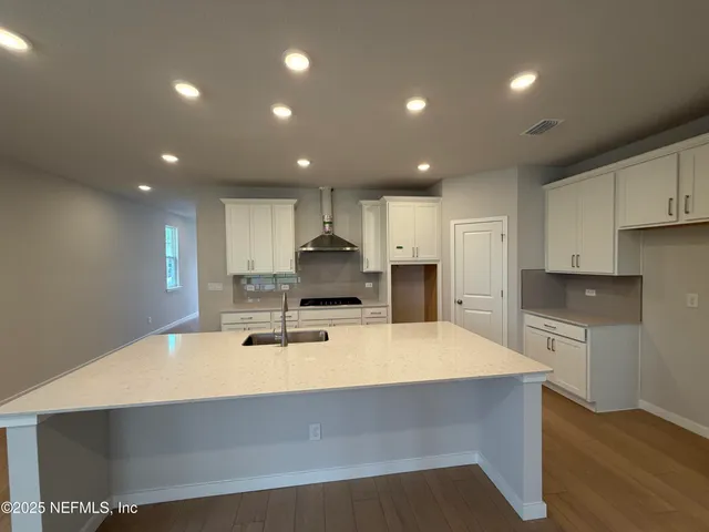 a view of a kitchen with a sink and dishwasher