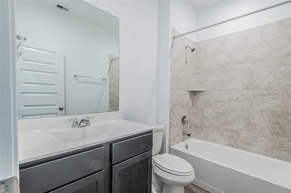 a bathroom with a sink a toilet and a bathtub