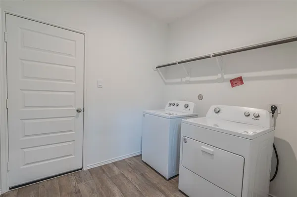 a view of storage and utility room with washer and dryer