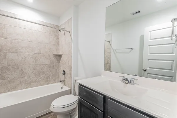 a bathroom with a sink a toilet and a bathtub