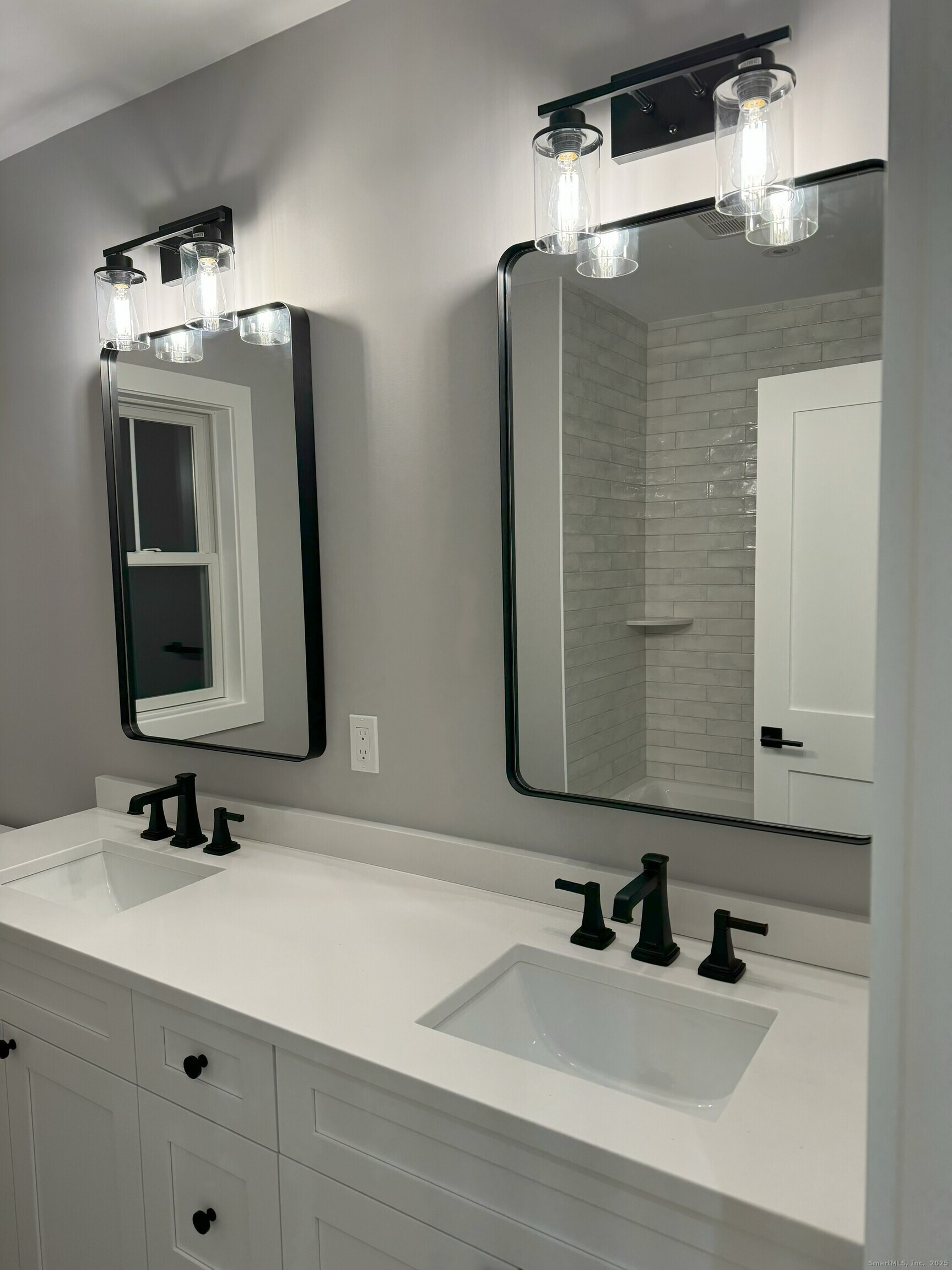 109 Signal Hill Road Wilton, CT 06897 - Photo 14 of 18 a bathroom with a sink double vanity and a mirror