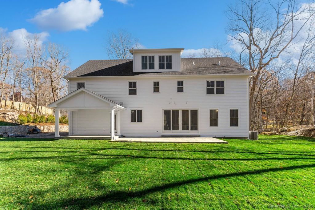 109 Signal Hill Road Wilton, CT 06897 - Photo 17 of 18 a front view of house with yard and green space