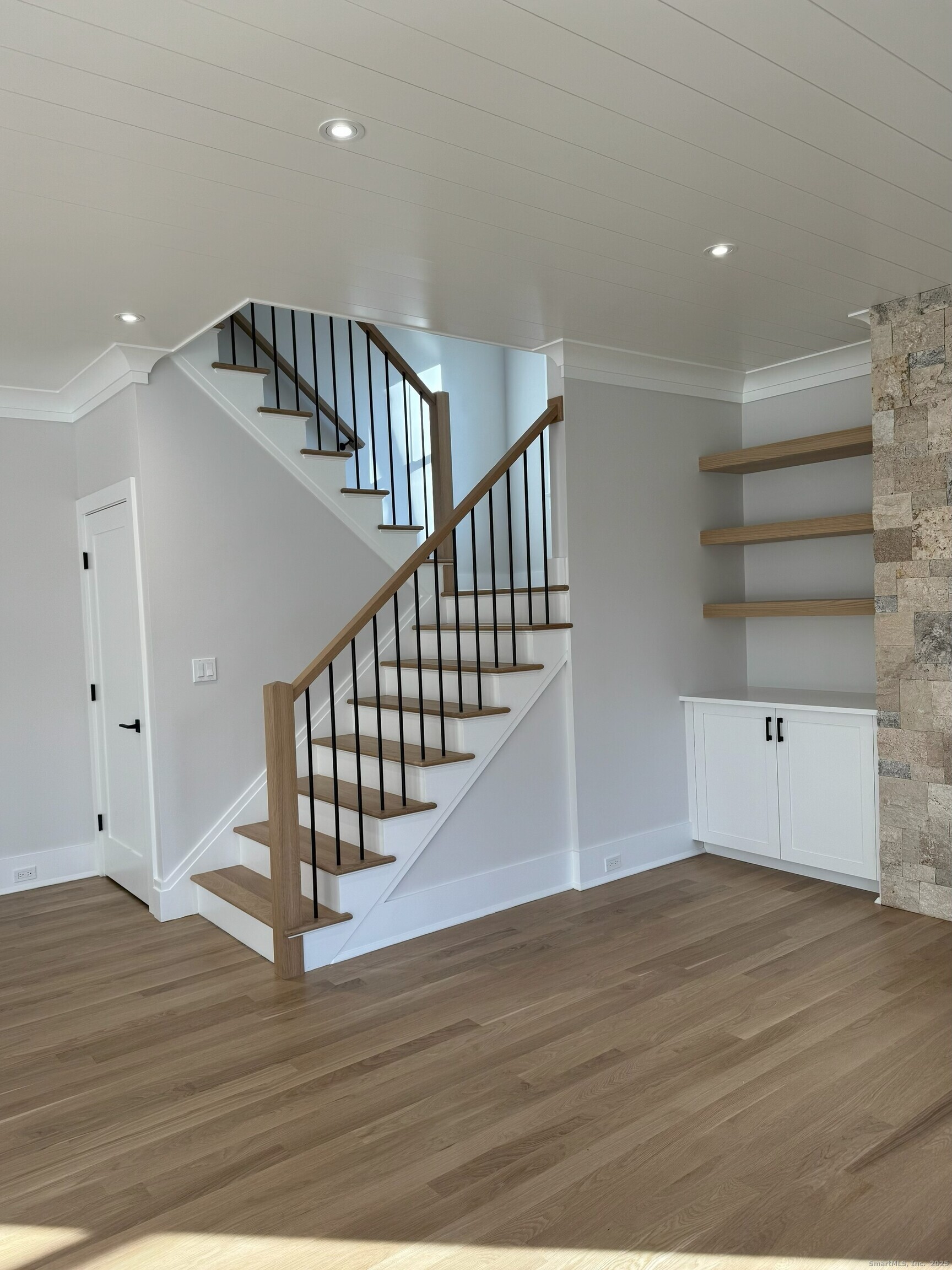 109 Signal Hill Road Wilton, CT 06897 - Photo 8 of 18 a view of staircase with white walls and wooden floor