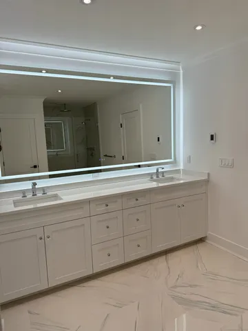 a bathroom with a sink and mirror