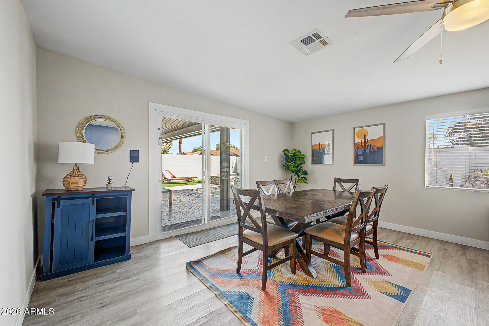 955 East Marigold Lane Tempe, AZ 85288 - Photo 12 of 32 a view of a dining room with furniture and wooden floor