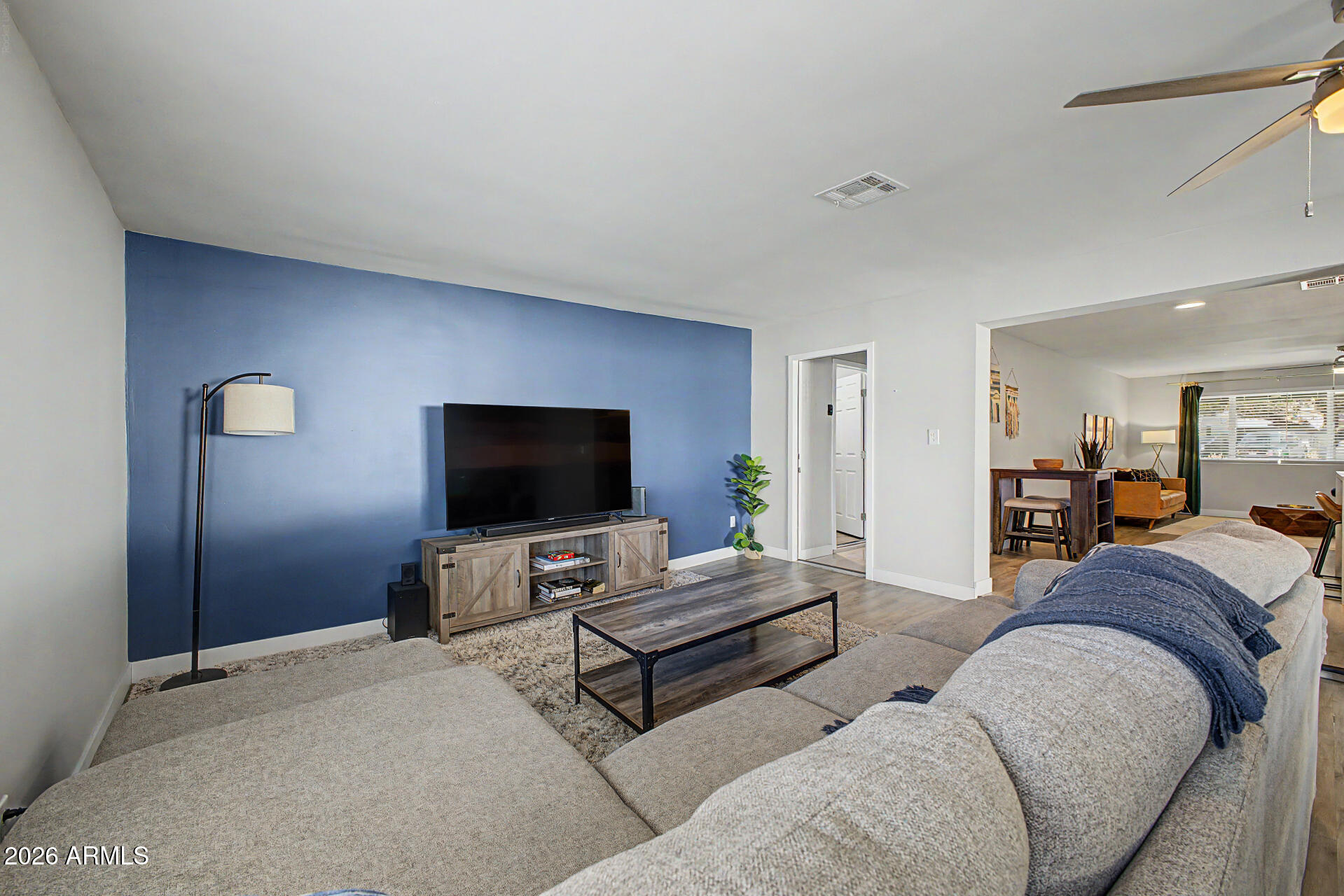 955 East Marigold Lane Tempe, AZ 85288 - Photo 13 of 32 a living room with furniture and a flat screen tv