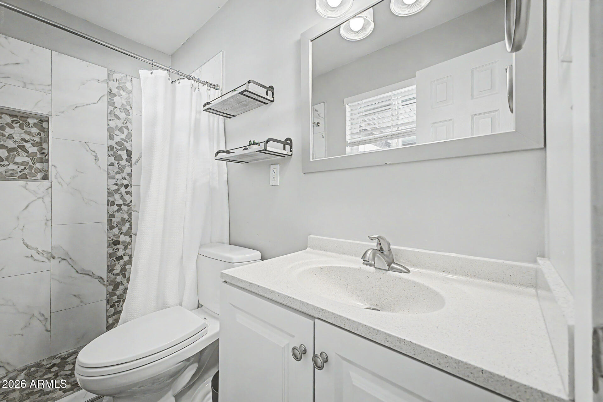 955 East Marigold Lane Tempe, AZ 85288 - Photo 17 of 32 a bathroom with a sink toilet and shower