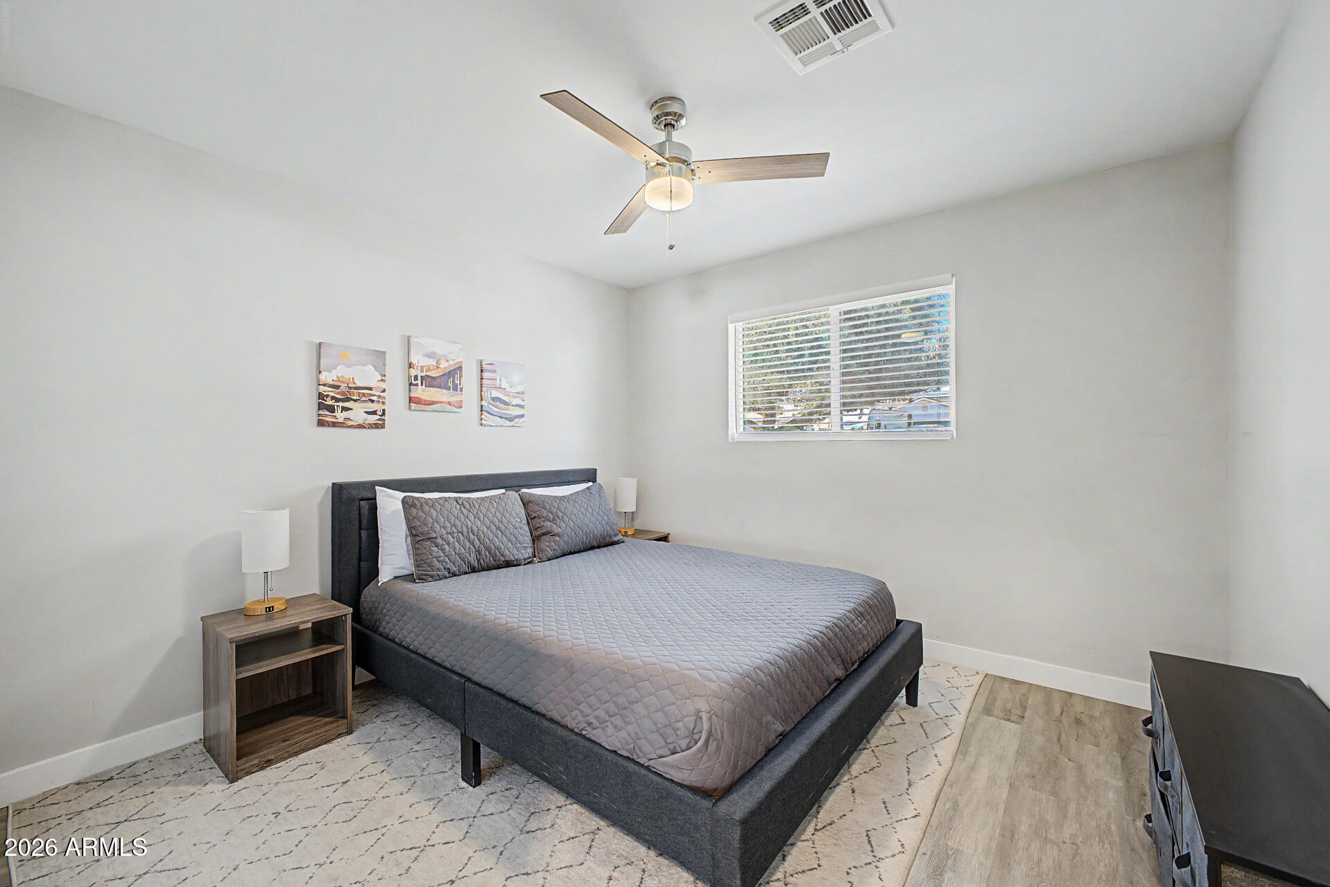 955 East Marigold Lane Tempe, AZ 85288 - Photo 19 of 32 a bedroom with a bed and window