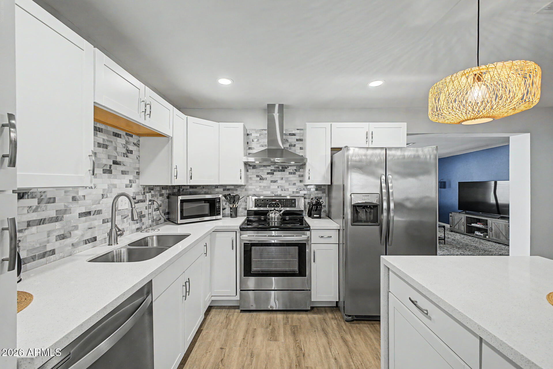955 East Marigold Lane Tempe, AZ 85288 - Photo 2 of 32 a kitchen with stainless steel appliances a refrigerator sink and microwave