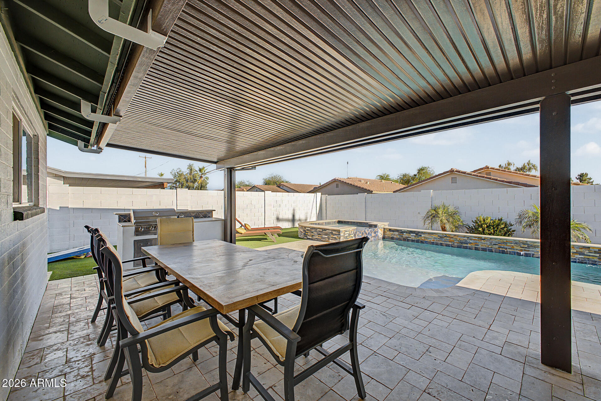 955 East Marigold Lane Tempe, AZ 85288 - Photo 27 of 32 a view of a patio with a table chairs and couches