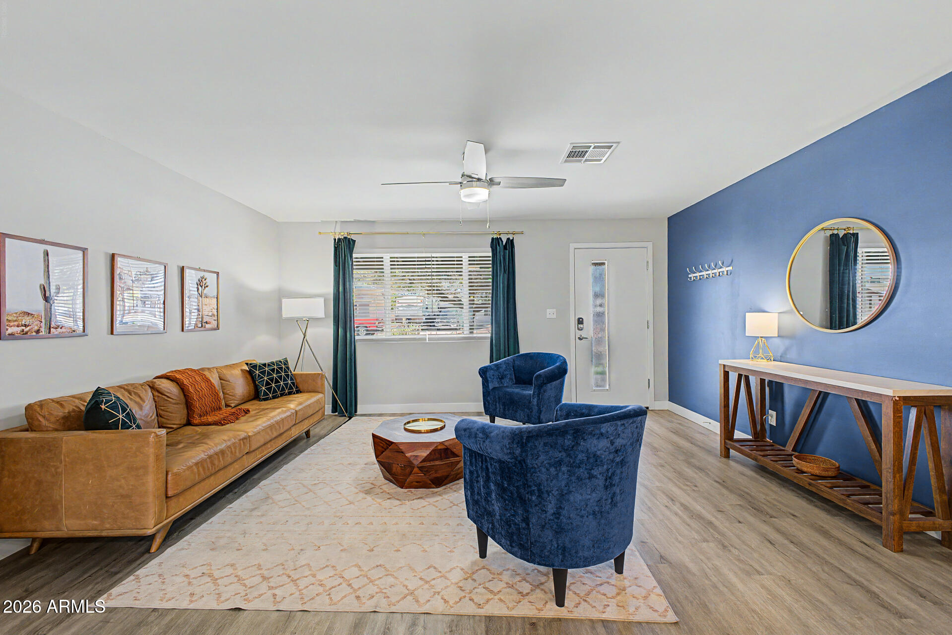 955 East Marigold Lane Tempe, AZ 85288 - Photo 3 of 32 a living room with furniture a rug and a window