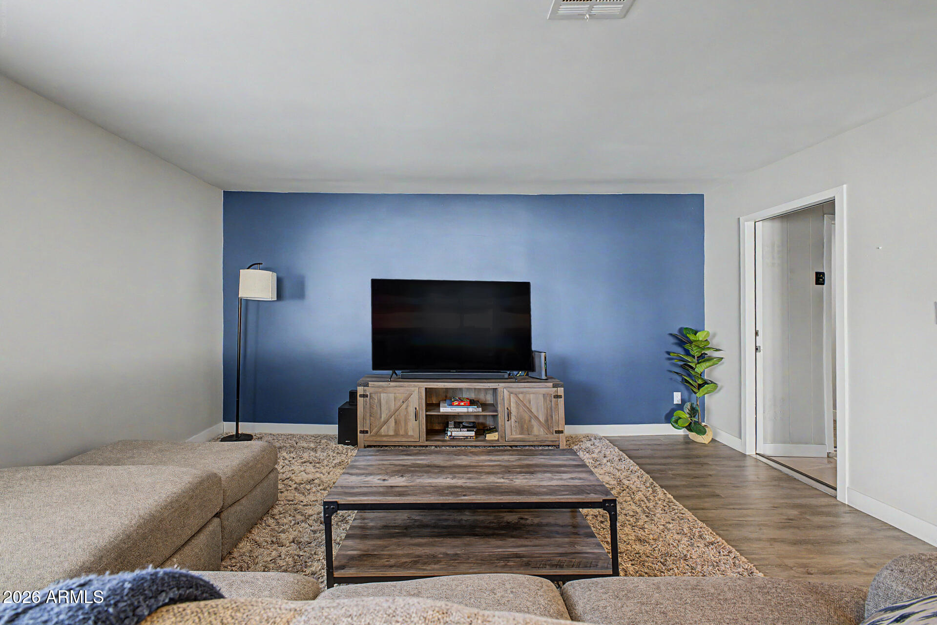 955 East Marigold Lane Tempe, AZ 85288 - Photo 4 of 32 a living room with furniture and a flat screen tv