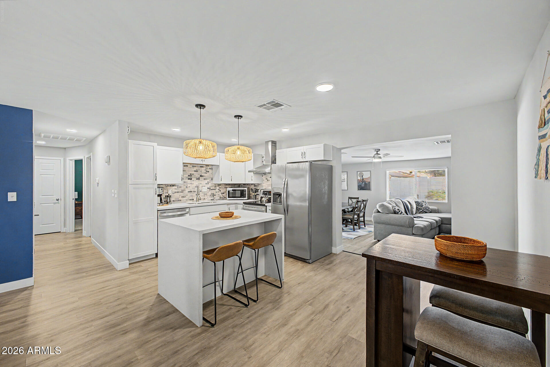 955 East Marigold Lane Tempe, AZ 85288 - Photo 5 of 32 a kitchen with a sink appliances and wooden floor