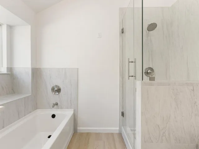 a spacious bathroom with a double vanity sink mirror and