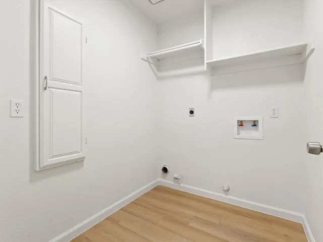 a bathroom with a double vanity sink mirror and toilet