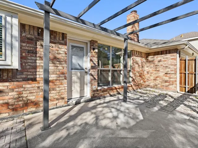 a view of a house with yard and sitting area